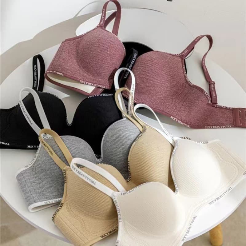 Women's push-up bra for small busts, without underwire, breathable, seamless, ribbed, padded thin straps, and designed for upward support.