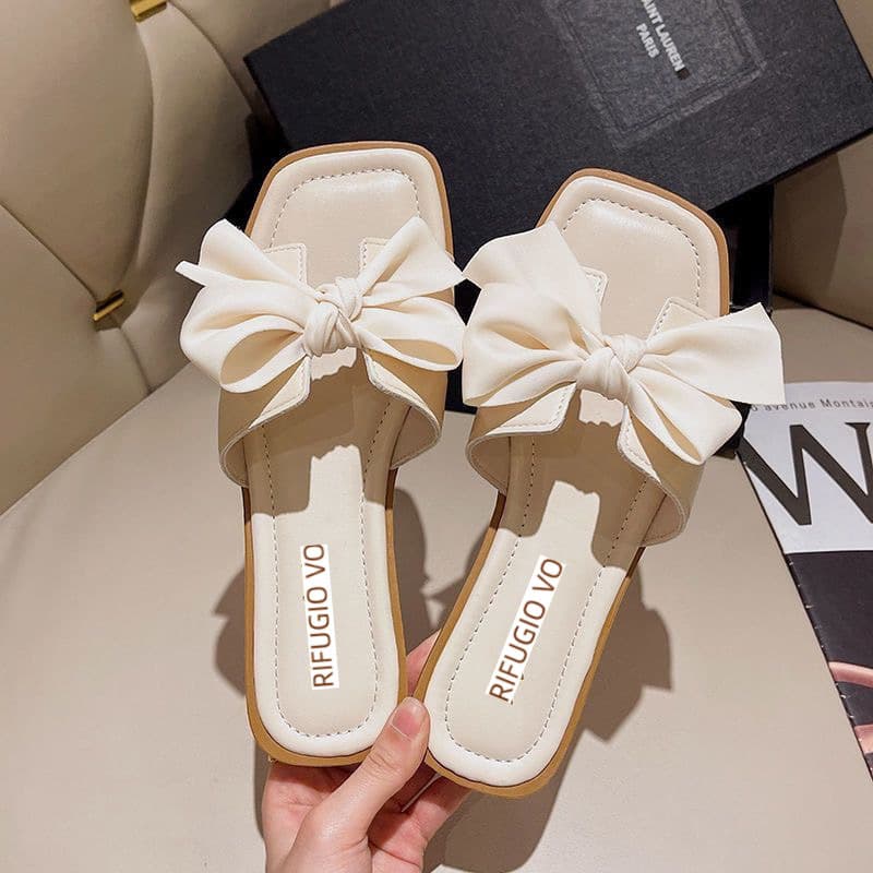 Elegant women's slippers, perfect for wearing outside, fairy style, 2025 new fashion, versatile flat, one-strap bow beach slippers