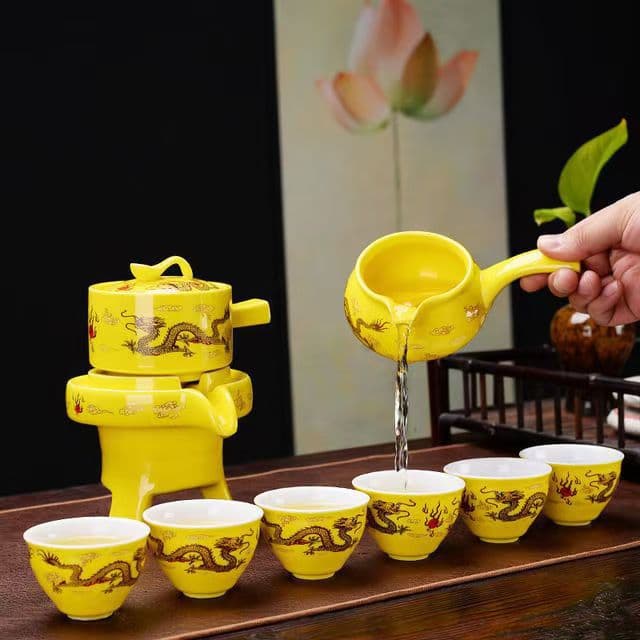 Turn around Qiankun automatic tea set lazy Wufu cattle tea maker anti-scald running tea set suit