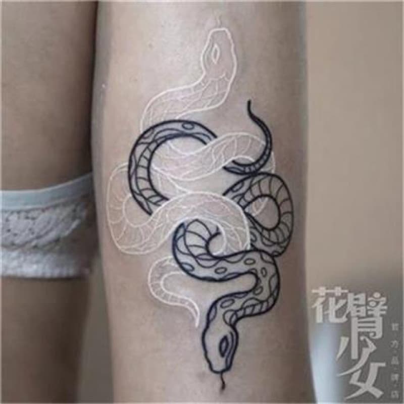 Tattoo for girls with full-sleeve tattoos: new technique, white and black snake tattoos, snake, black and white lines, python arm, dark design.