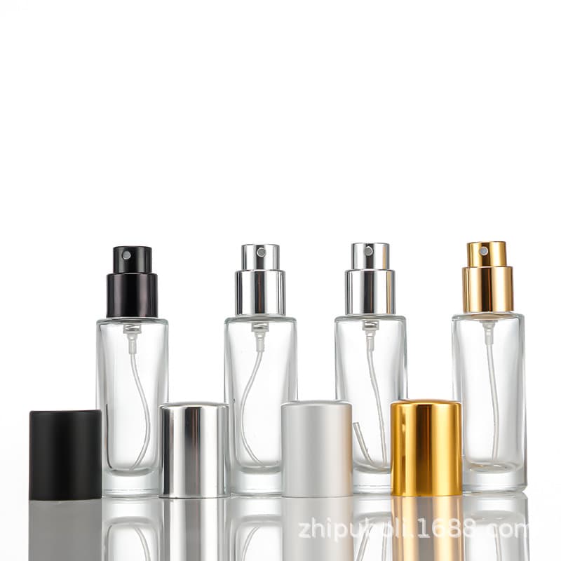 Wholesale 10ml perfume decanting bottles with multi-colored caps, travel-sized empty glass spray bottles.