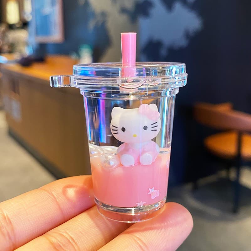 Cute Hello Kitty glitter keychain for women, creative cartoon doll, student backpack charm, car keychain, small ornament.