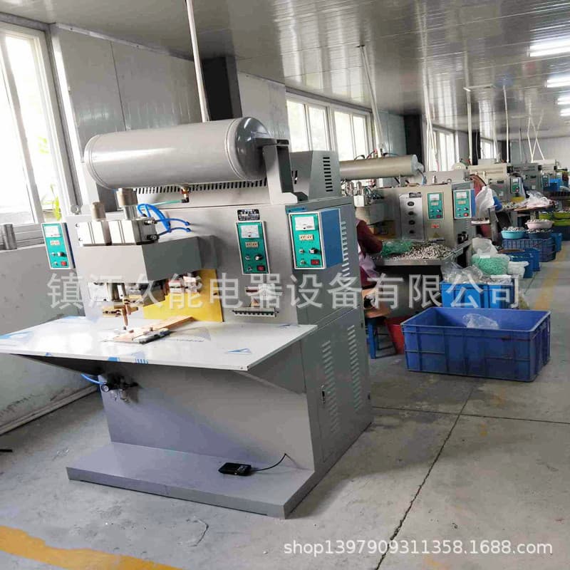 Four-head pneumatic capacitor cover welder performs one pneumatic welding operation (four nails for high efficiency).