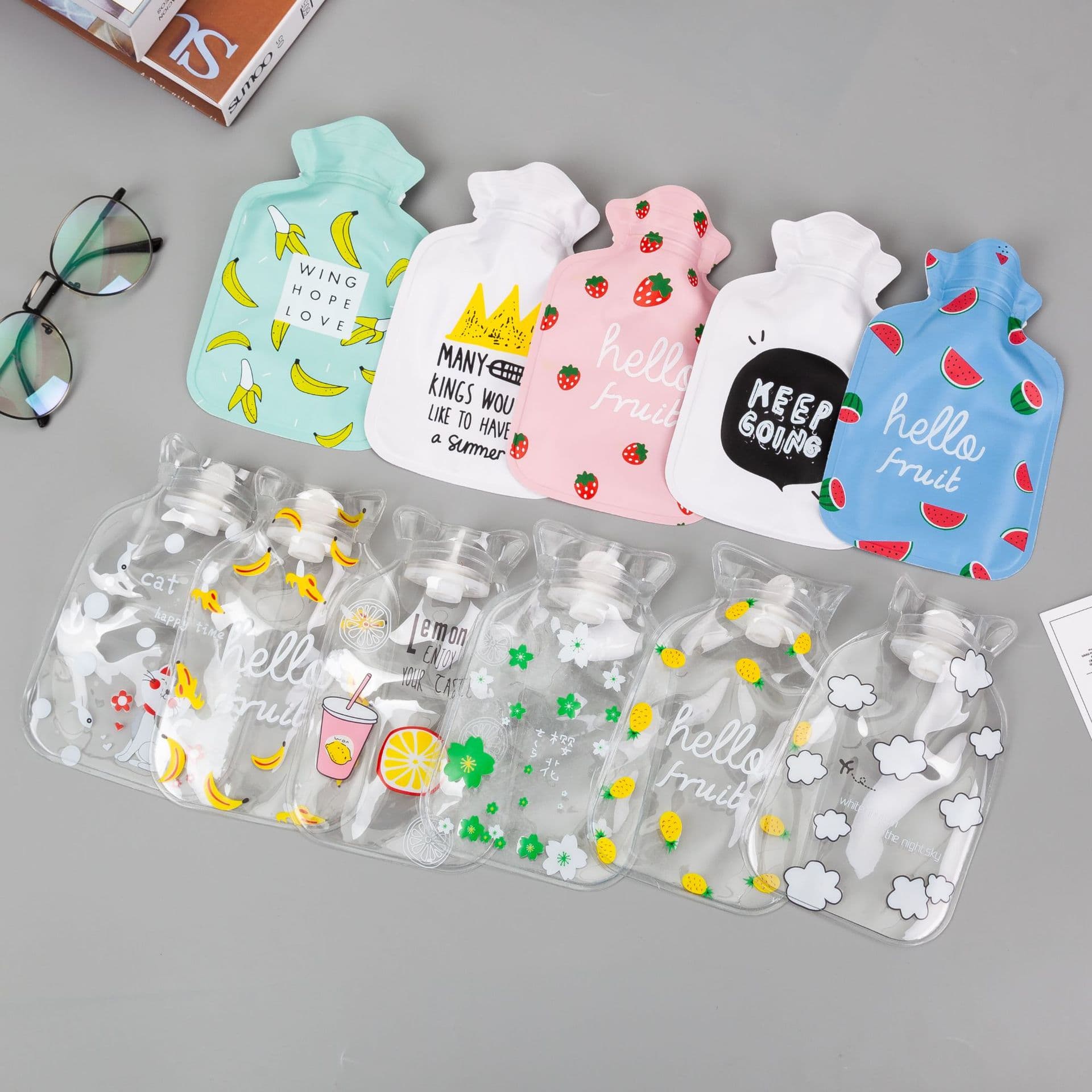 Wholesale cute cartoon PVC hot water bottles with printed logo, small fillable hand warmers as gifts