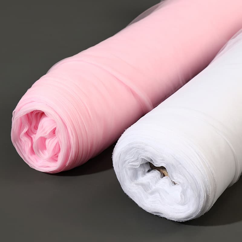 Dense Swiss soft tulle, American mesh for chair backs, aisle markers, arch decorations, and wedding setup including veils and ceiling drapes.