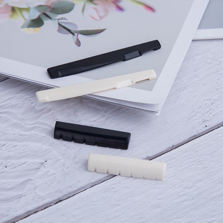Nuts, folk classical universal guitar upper and lower pillows, plastic bridge upper and lower pillows, wholesale universal musical instruments