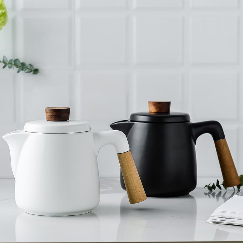 Creative and minimalist Japanese matte ceramic tea set with wooden handle. Afternoon tea set.