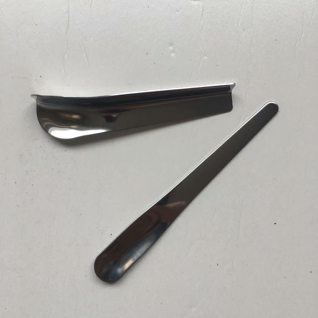 Stainless steel corner sealing tool, tile grout application tool set, including corner sealing tool and corner scraper.