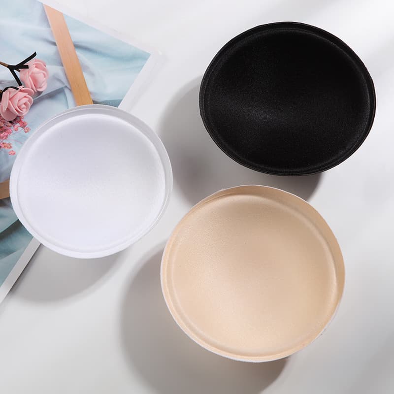 Manufacturer of hard cotton round cup bras, underwear molded cups, yoga wear, sponge inserts, breast pads, round bra cups