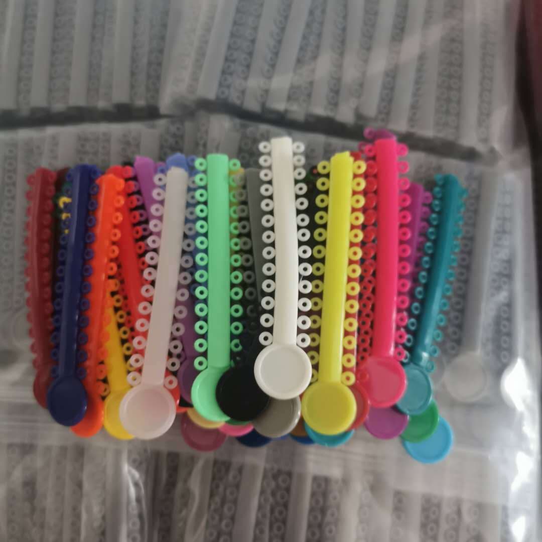 Orthodontic consumables, oral ligation rings, orthodontic ligation rings, plastic colored ligation rings, dental materials, a pack of 40 pieces