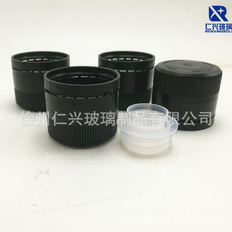 Olive oil bottle caps in stock, plastic tamper-evident caps with spouts, spiral threaded export-grade tea oil caps.