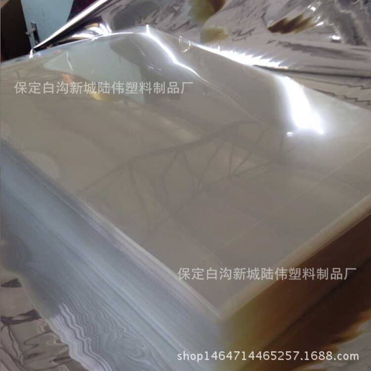 Manufacturer supplies PET film, gift box window polyester film, and cellophane; customization supported.