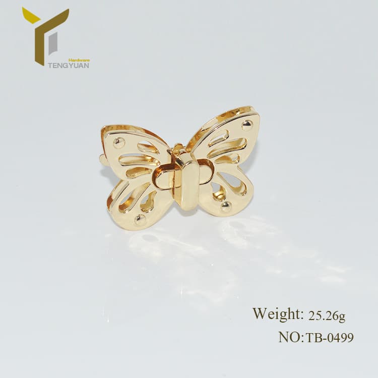 Handbag and luggage hardware accessories butterfly lock, zinc alloy die-cast women's bag front decorative push lock, light gold, in stock.