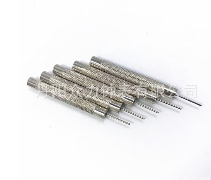 Watch repair tools: Strap removal tool, small punch, pin, adjustment pin, steel strap removal punch, strap removal pin punch.