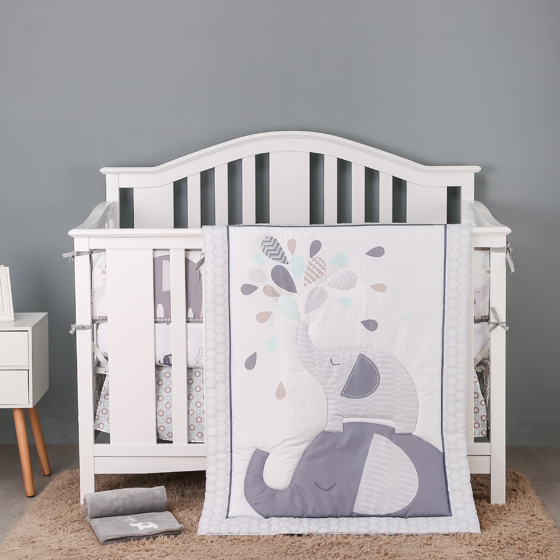 Newborn baby bedding set, including blankets, crib bumpers, fitted sheets, and crib skirts (4 pieces).