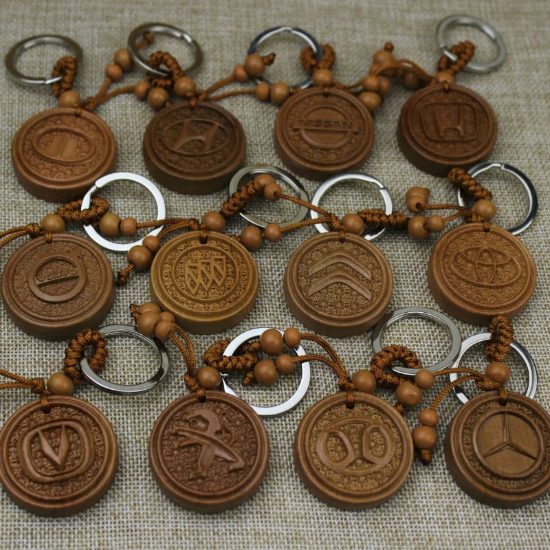 Wooden car keychain wholesale peach wood car logo interior pendant running Jianghu stall supply logo