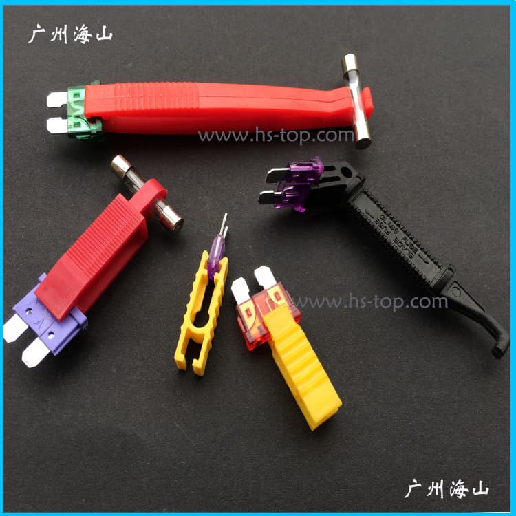 Car Fuse Puller Tool in Red, Black L-Shaped Plastic Clamp, and Yellow Clamp