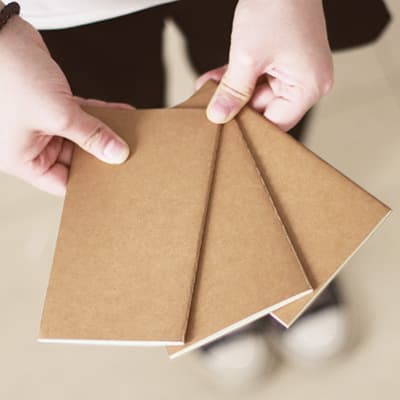 Portable Vintage Kraft Paper Notebook with Blank Inner Pages Sewn Binding Creative Retro Design Ideal for On-The-Go Notes