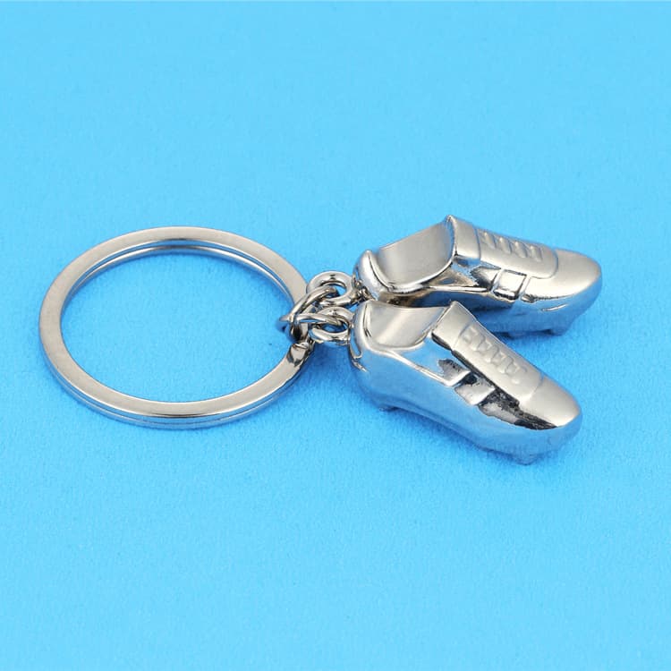 Dongguan manufacturer creative football shoe keychain, personalized metal keychain, fashion gift, laser logo available
