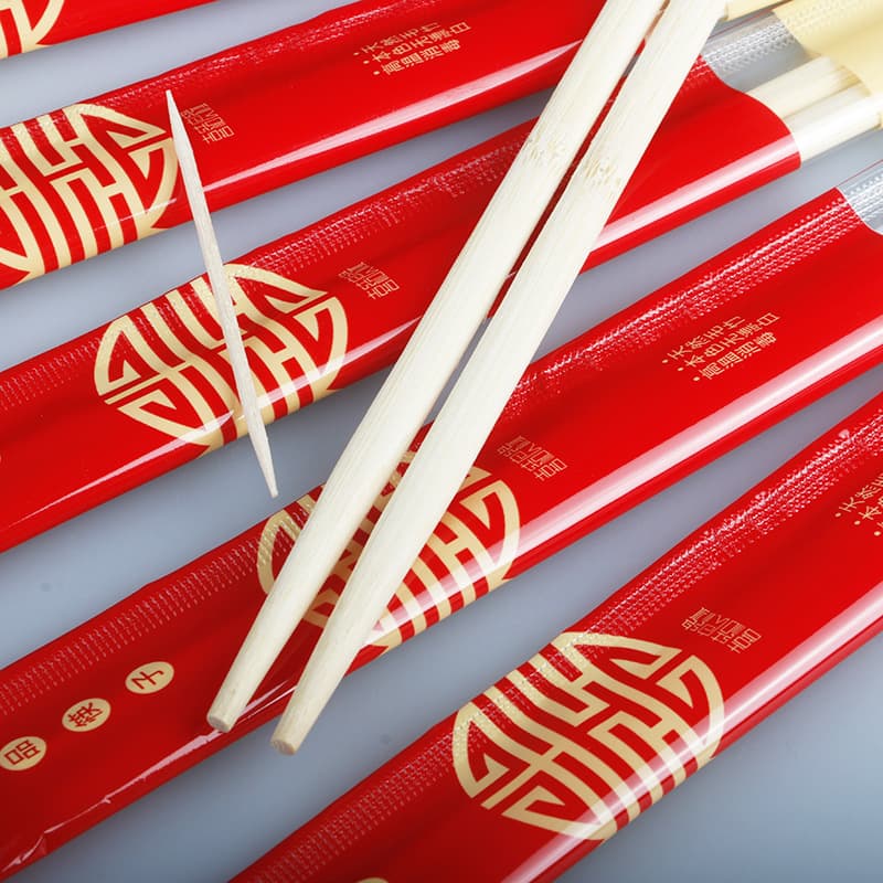 Manufacturer wholesale festive disposable chopsticks and toothpicks, wedding red individually wrapped bamboo joint chopsticks for wedding banquets.