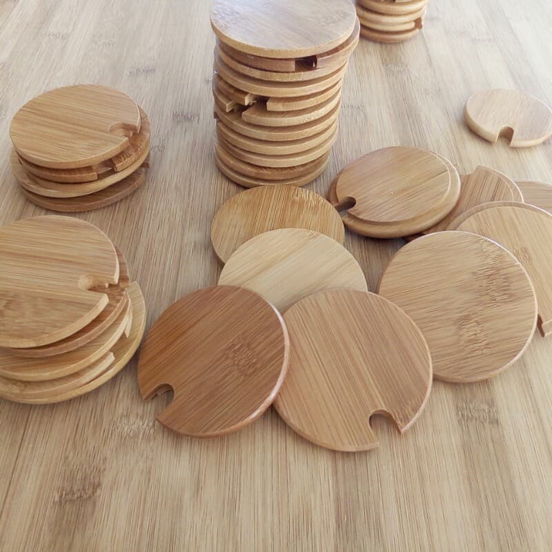 Factory direct sales of bamboo and wood lids, ceramic mug lids, and glass storage lids. Logo customization available.