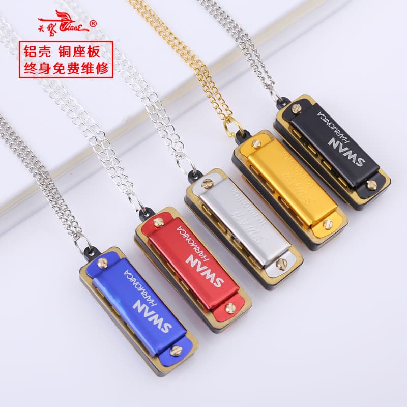Cross-border Swan 4-hole 8-note mini harmonica for children and students, beginner wind instrument, factory direct sales.