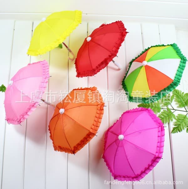 Offer children's solid color lace-trimmed toy umbrellas, cute decorative umbrellas, and exquisite mini umbrellas at great prices.