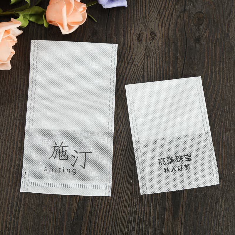 Custom disposable non-woven jewelry dust-proof flat bags for bracelets and beaded strings with drawstrings