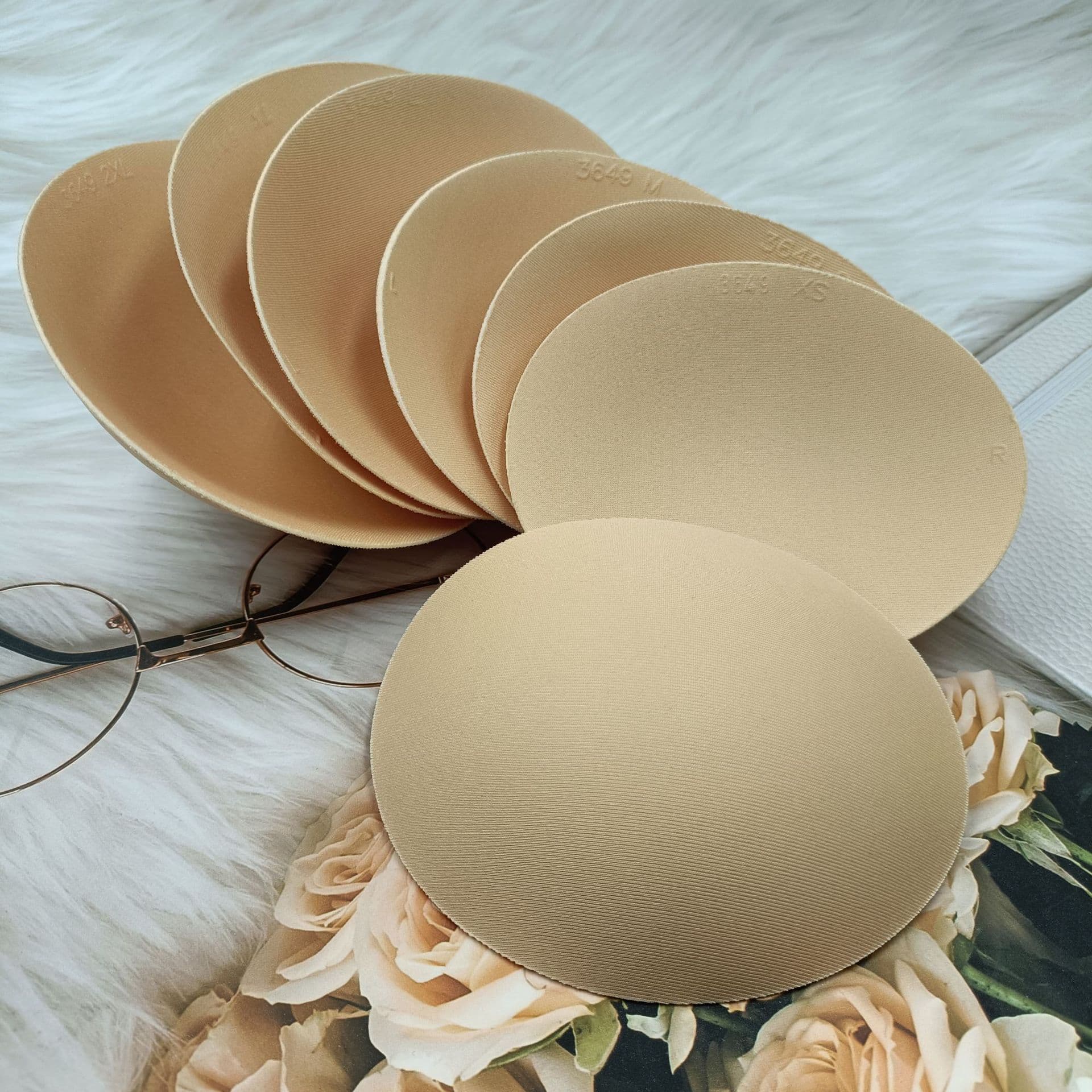 Oval-shaped sponge bra pads for yoga wear, sports bras, swimwear, loungewear, inserts, in stock, invisible.