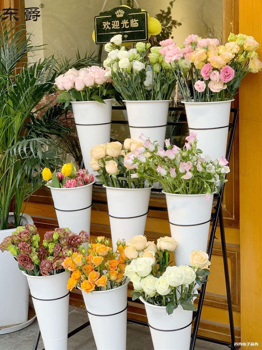Florist flower racks, flower display stands, multi-tiered movable wheeled flower arranging buckets, and floral arrangement racks.