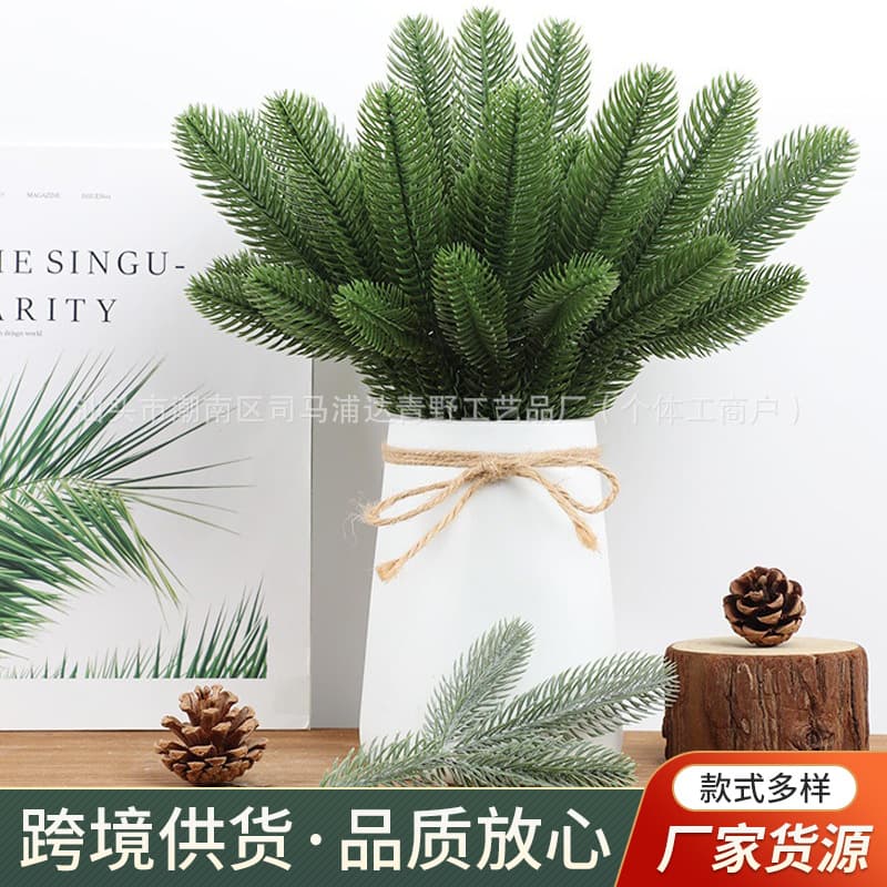 Simulated plastic three-dimensional double-sided pine needles for Christmas tree wreaths and decorations.