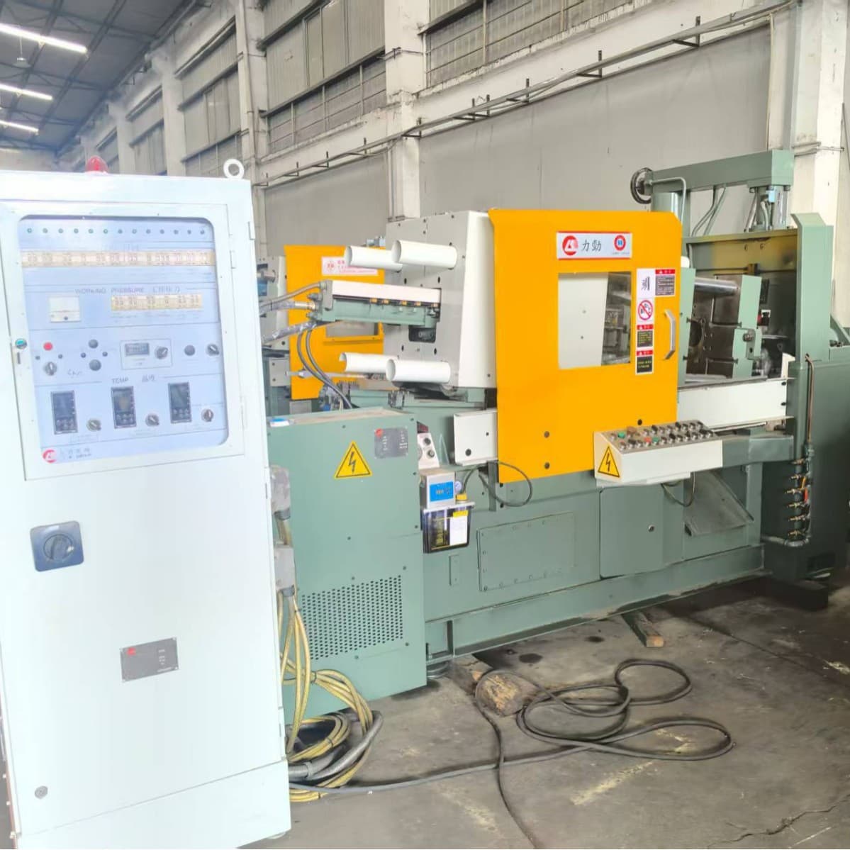Used die casting machines, 88-ton and 160-ton Lijing hot chamber die casting machines.
