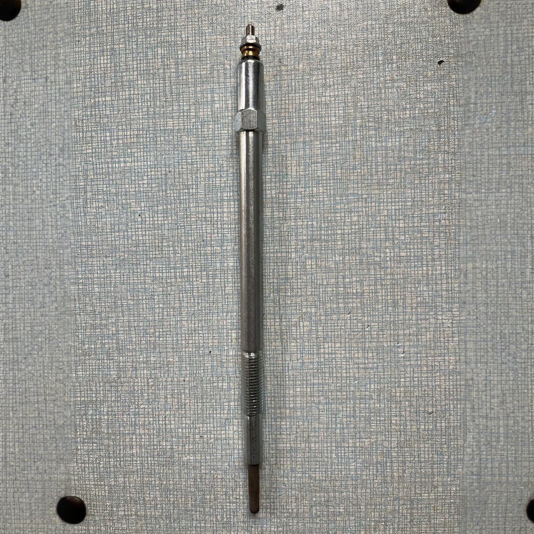 11065-2W202/A is a glow plug for the Nissan Patrol Y61 ZD30 engine. It is an automotive part with a glow plug.
