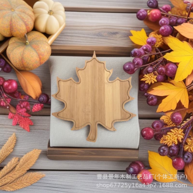 Ready-to-ship bamboo cutting board with grooves, maple leaf-shaped snack and dry fruit tray, candy dish for party decorations.