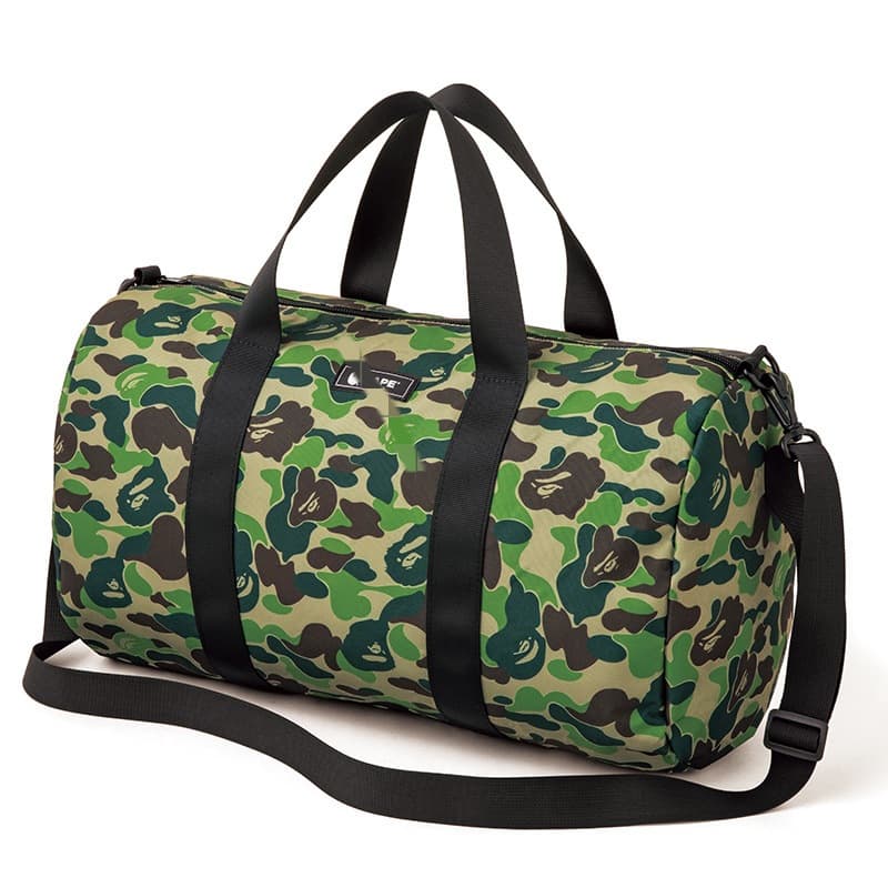 Japanese magazine-style green camouflage outdoor travel bag, waterproof cylindrical hand-held shoulder bag available now.