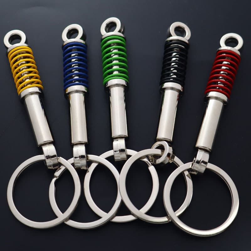 Mini car shock absorber keychain metal shock absorber keychain decompression artifact gift gift wholesale printed logo