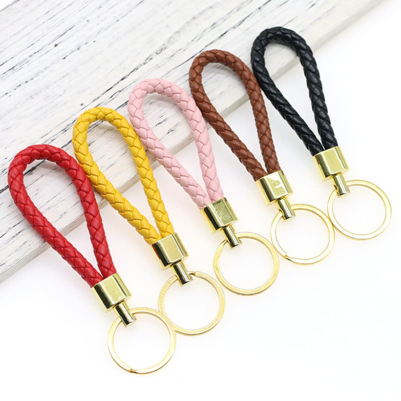 PU leather braided car keychain pendant ring cartoon doll braided rope high-end keychain accessories for men and women couples