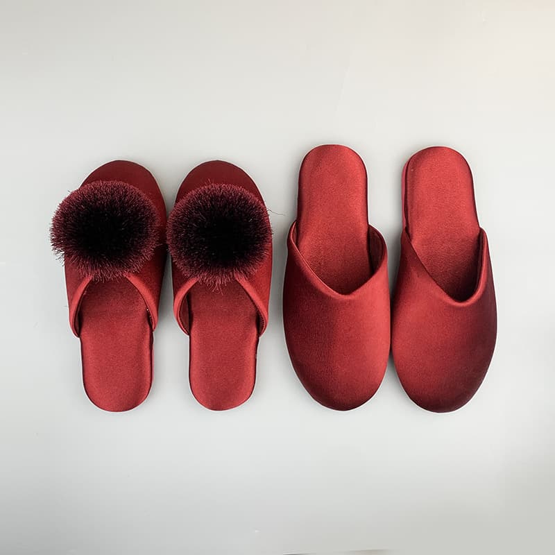 A pair of festive red wedding slippers with a premium feel, designed for bride and groom, newlyweds' home use, warm enclosed cotton slippers.