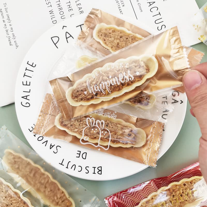 Caramel fish-shaped glutinous rice boat sealed packaging bag lollipop sealing machine sealing bag lollipop individual packaging bag