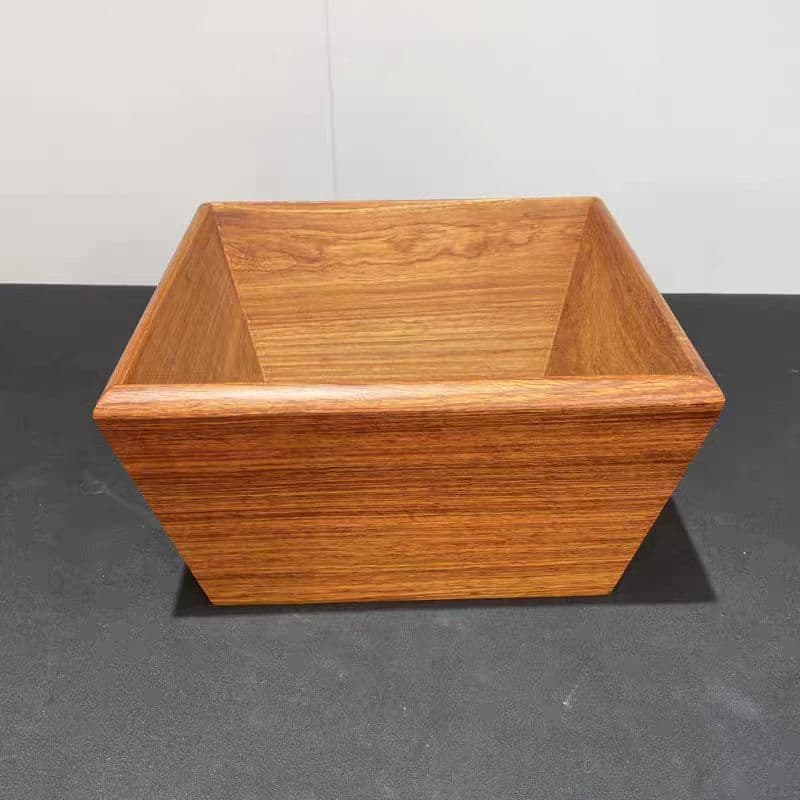A vintage-style solid wood rice measure in rosewood color, symbolizing wealth and prosperity. A decorative piece for the living room, suitable for business openings.