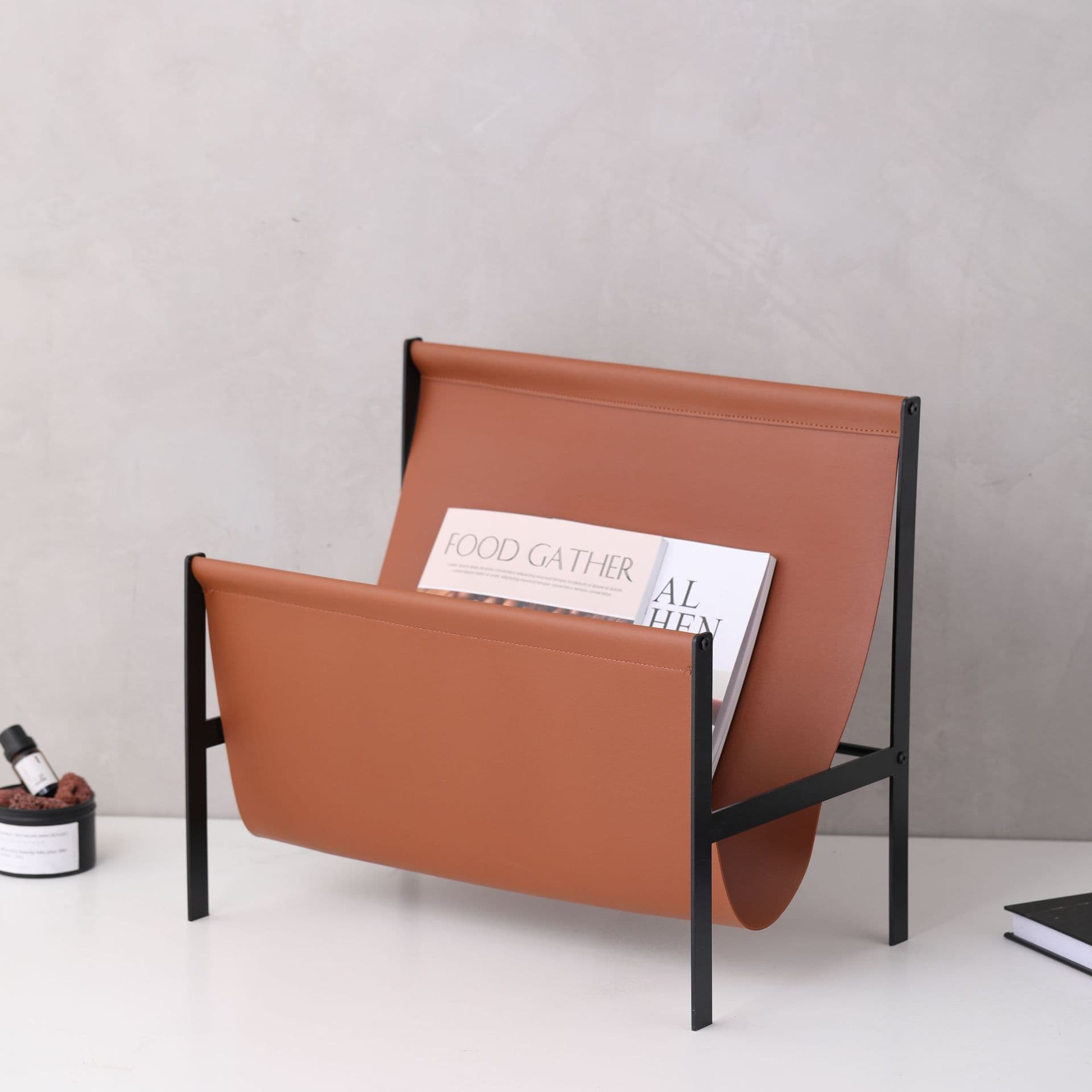 Modern minimalist luxury metal and leather magazine rack, newspaper rack, study storage shelf, showroom home soft furnishings.