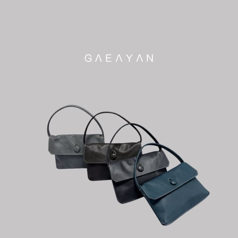 Minimalist cowhide button small handbag mobile phone bag