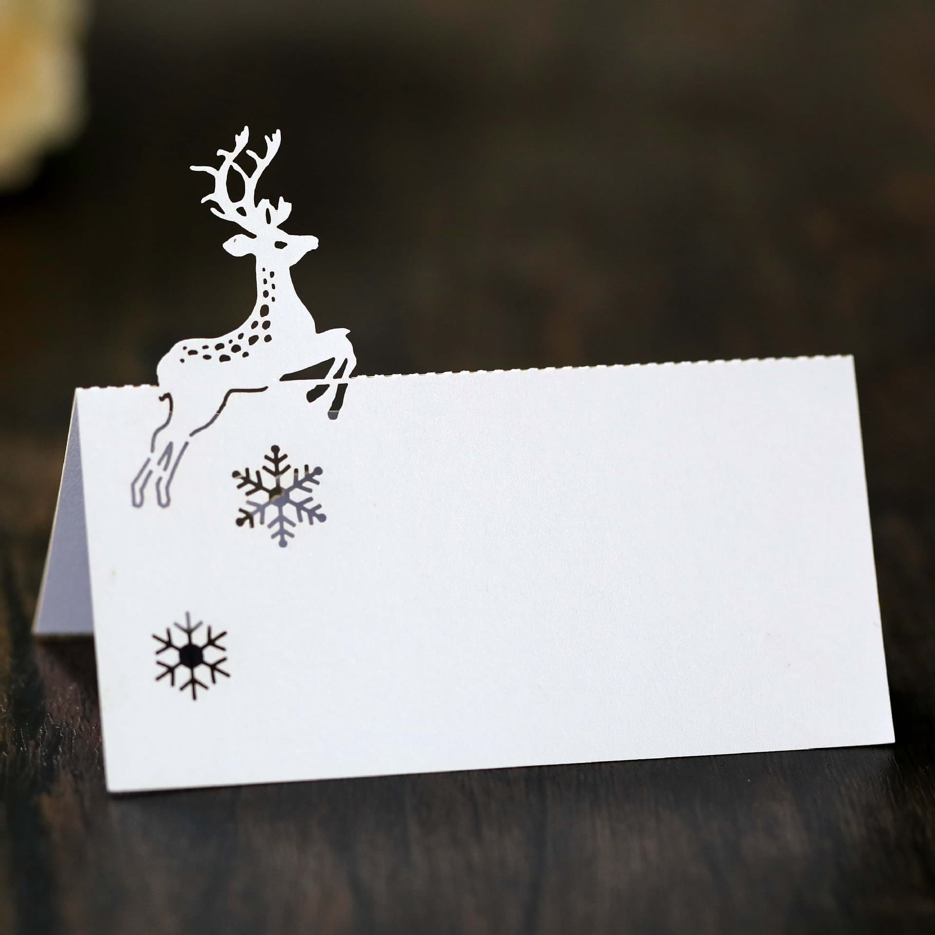 Amazon laser-cut beautiful reindeer Christmas white snowflake place cards, holiday name table cards, ready-to-ship.