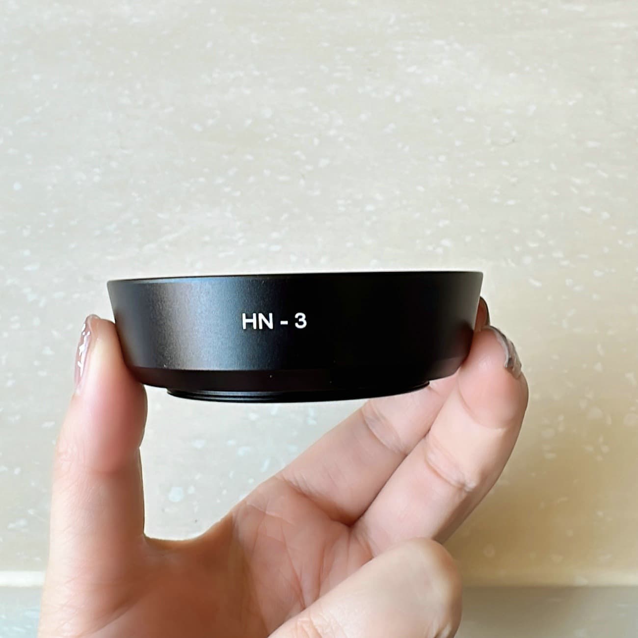 The HN-3 metal lens hood is compatible with Nikon 35/2D, 35/1.8G, 50mm f/1.8, 50mm f/1.4, and 52mm screw mount lenses.