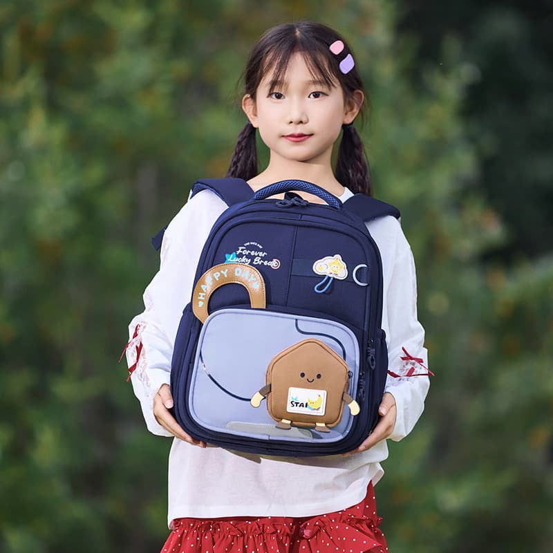 Cute cartoon color-blocked schoolbags for primary school students, lightweight and burden-reducing casual backpacks for men, women and children, multi-layer wear-resistant backpacks