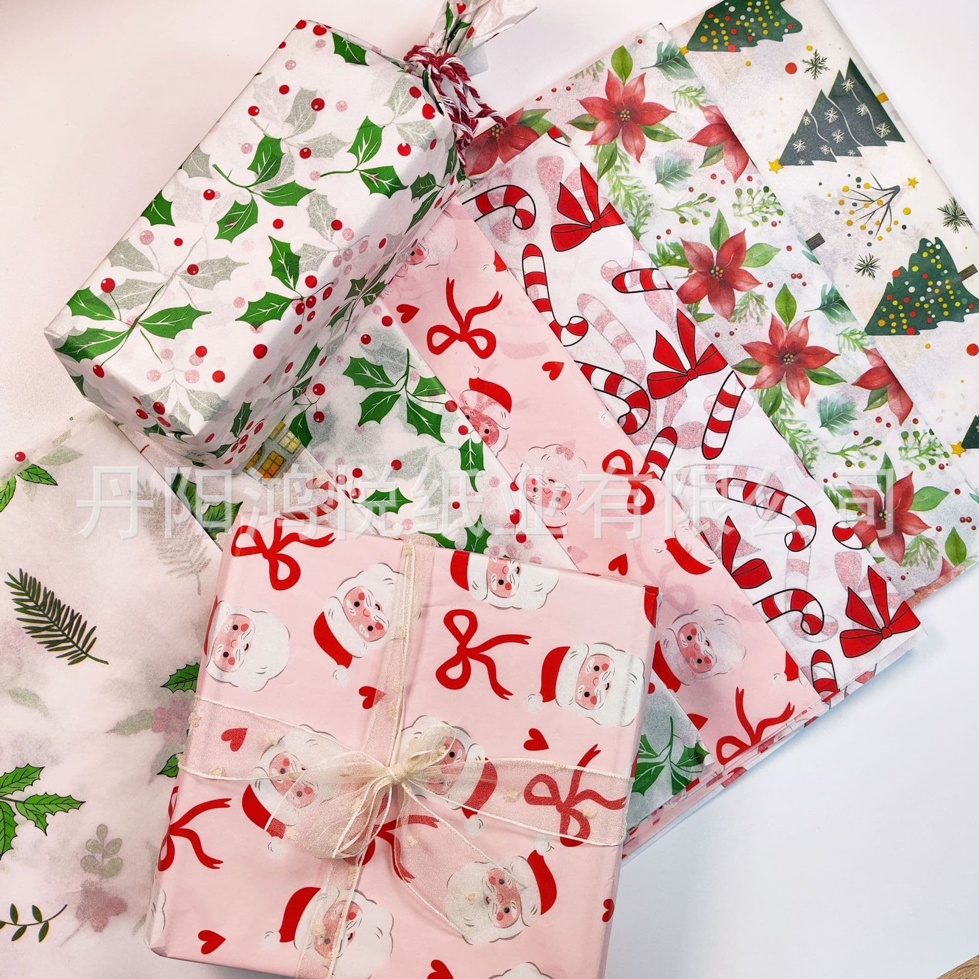 17g tissue paper with Christmas elements like Santa, lights, candy canes, and bows, available wholesale and for origami