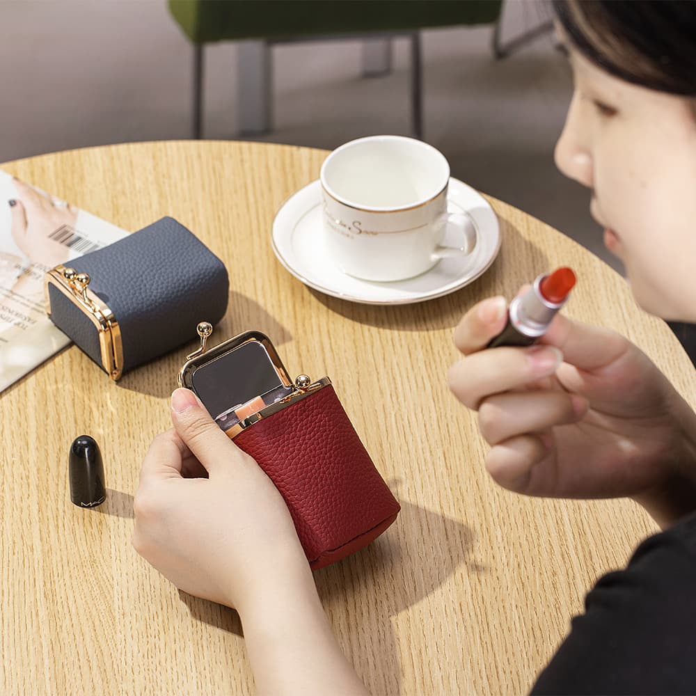 New top-grain cowhide lipstick pouch with mirror, a sophisticated and portable small coin purse for women.