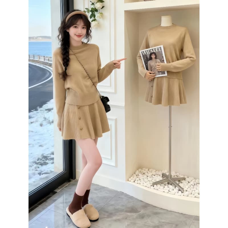 A unique and stylish Korean-style two-piece set featuring a retro sweater top and knitted A-line skirt.