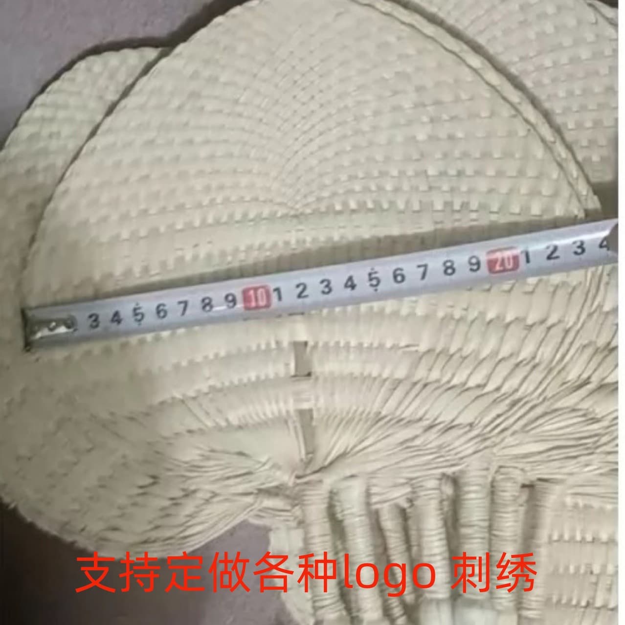 Handwoven palm leaf fan with bamboo stick core, summer fan