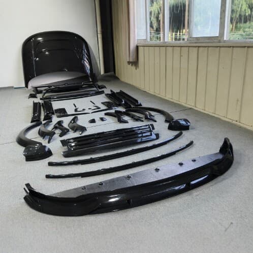 Dry carbon body kit for Land Rover Range Rover LWB including front lip, rear lip, side skirts, spoiler, and hood modification parts